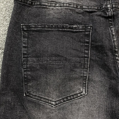 AMIRI VARSITY LOGO REPAIR JEANS
